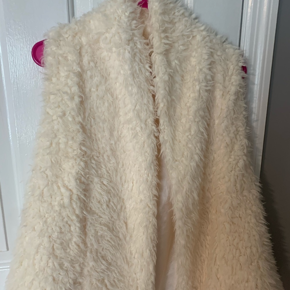 White fur vest